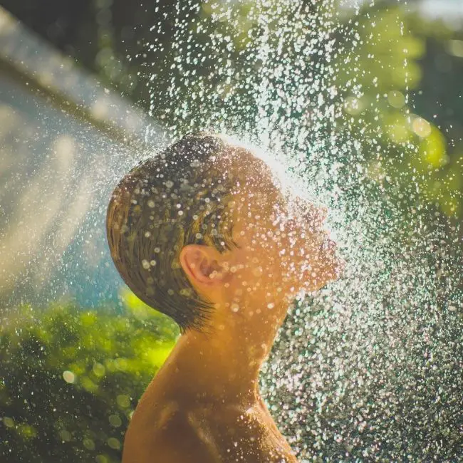 should you shower after tanning